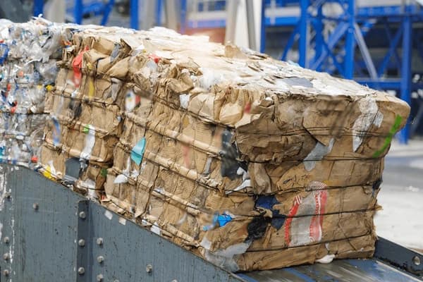 Large warehouse with OCC bales
